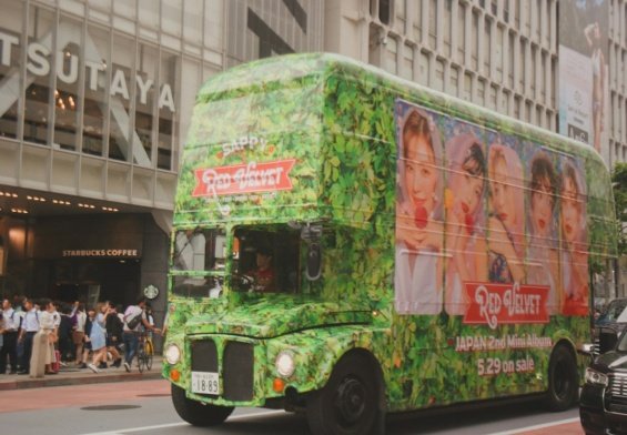 green bus near building