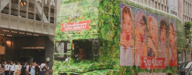 green bus near building